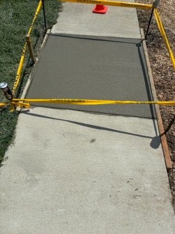 New level concrete slab taped off to cure