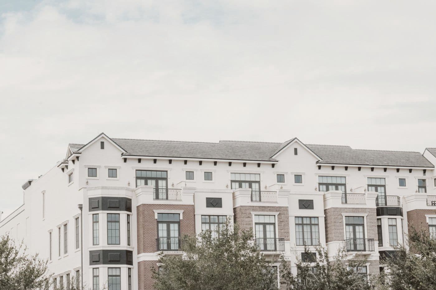 Four-story apartment building with balconies