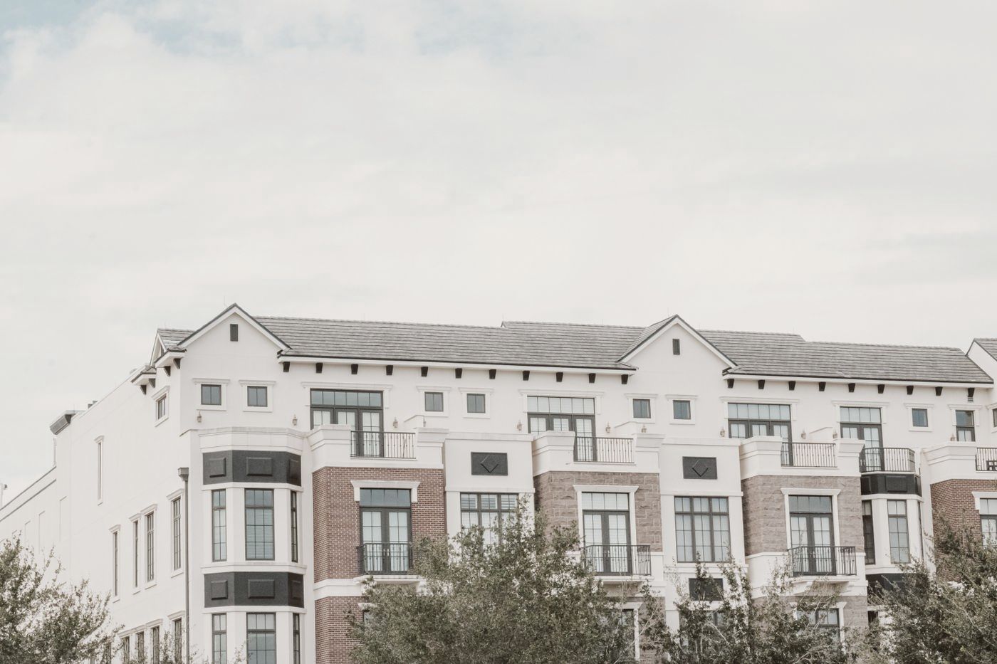 Four-story apartment building with balconies