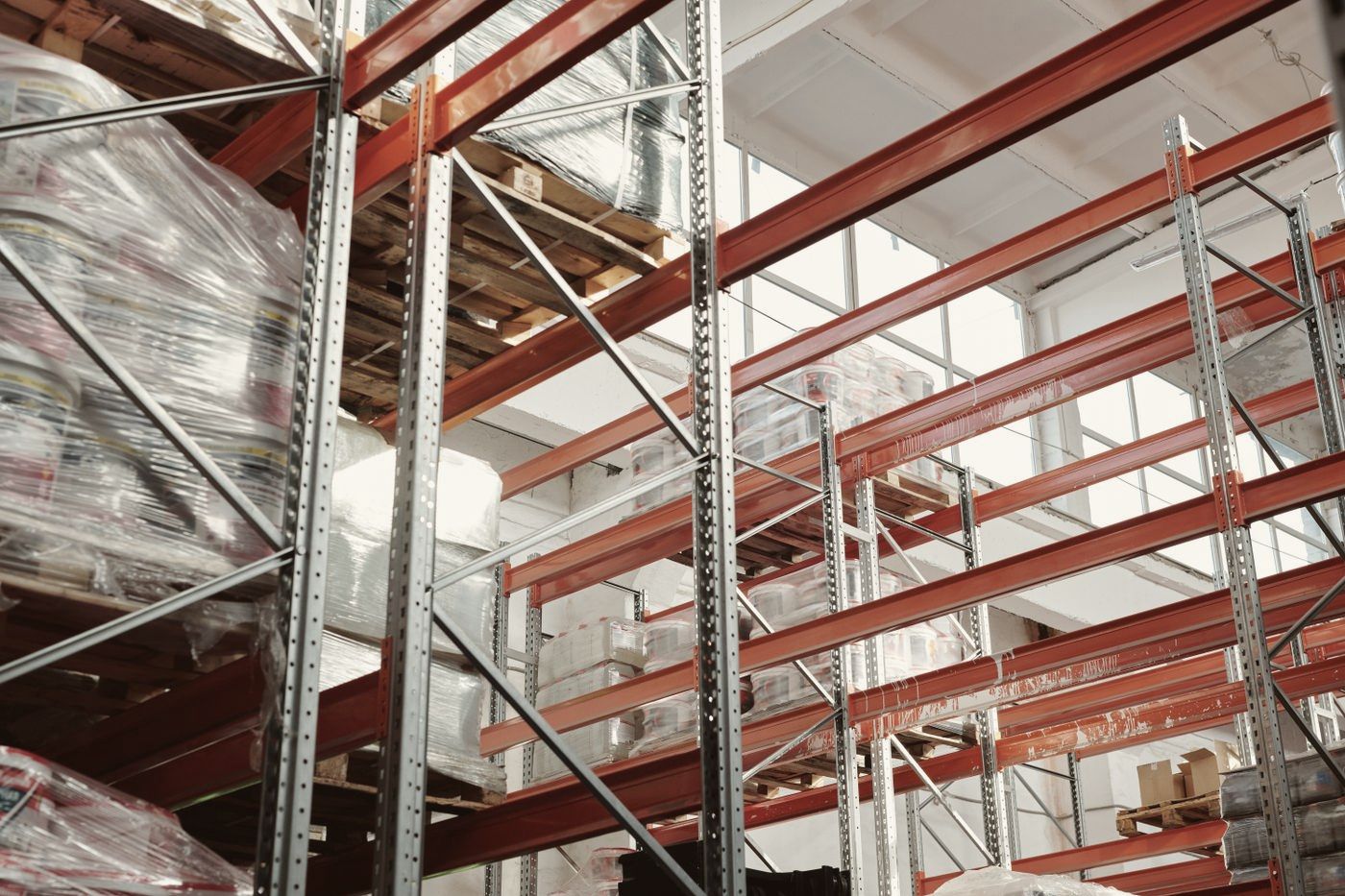 Warehouse aisle with tall pallet racking